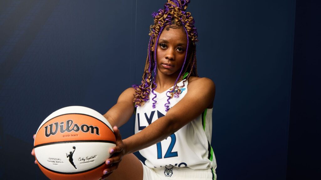 Qunesha Lockett posing with basketball
