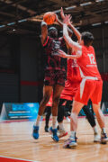 Two men playing basketball