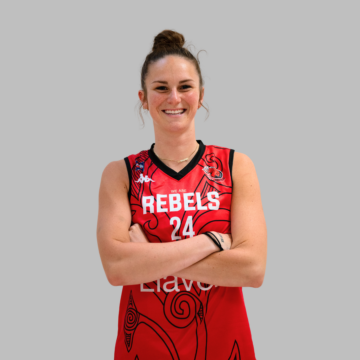 Female basketball player with crossed arms smiling