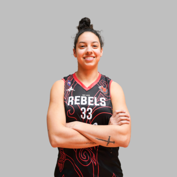 Female basketball player crossing her arms and smiling