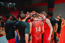 men basketball team huddle