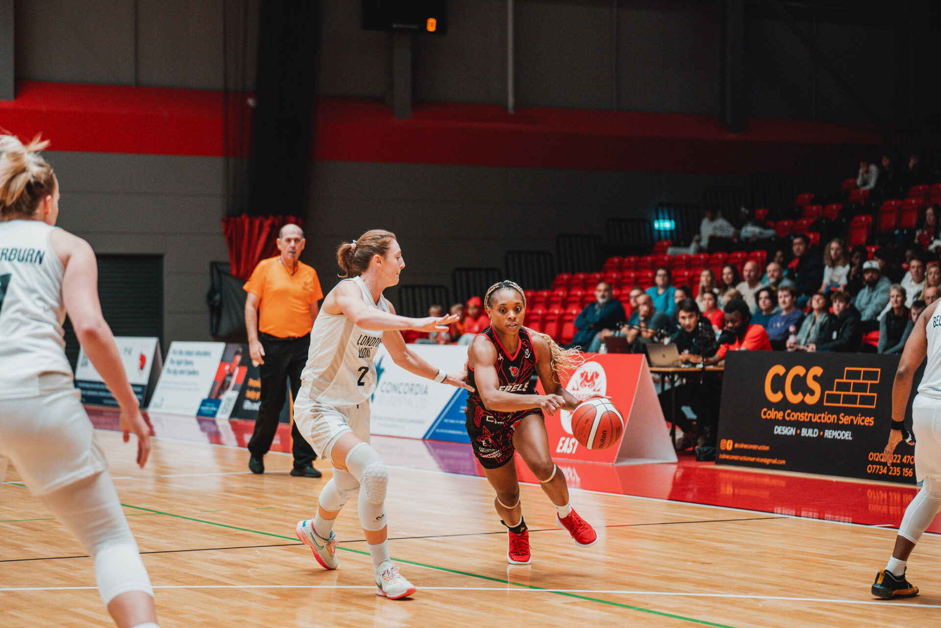 womens basketball player attacking the basket