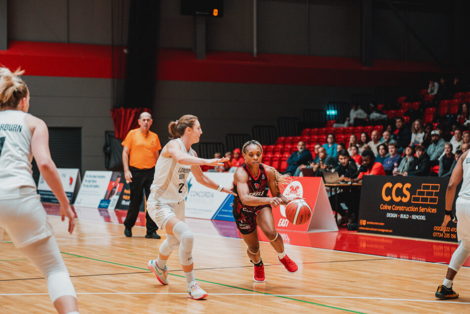 womens basketball player attacking the basket