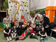 group pictures of rebels players and social workers at go bananas