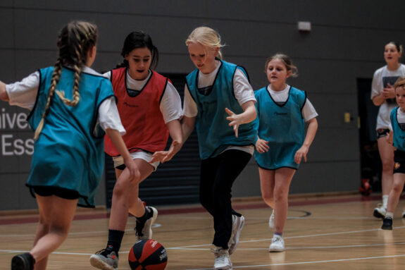 Group of children playing basketball