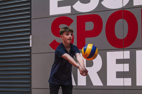 young kid playing volleyball
