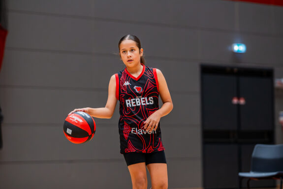child playing basketball