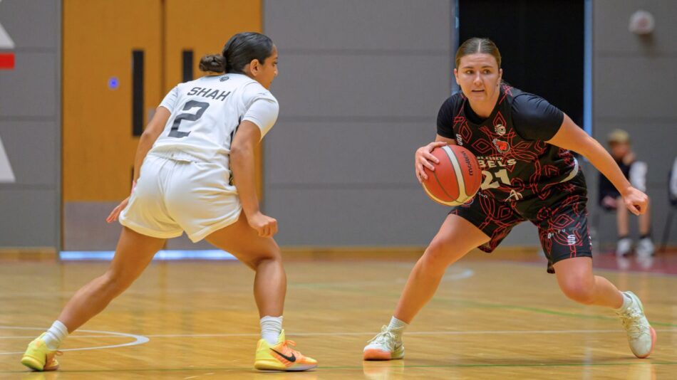 Paige Meyer dribbling the basketball