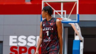 Michael Amako walking and looking to the side