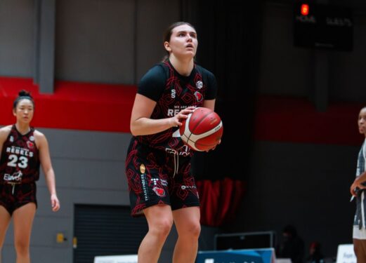 Women's Rebels Basketball player holding the ball
