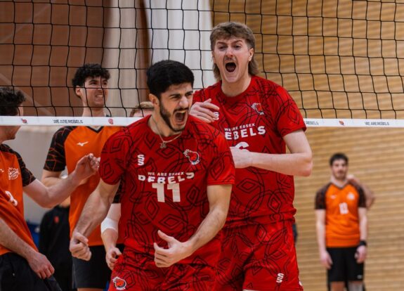 Men's Volleyball players celebrating