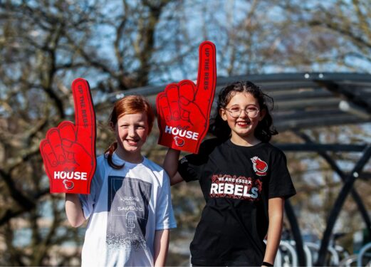 Kids support the Rebels with giant foam hands and 'we are Essex Rebels' T-shirt on